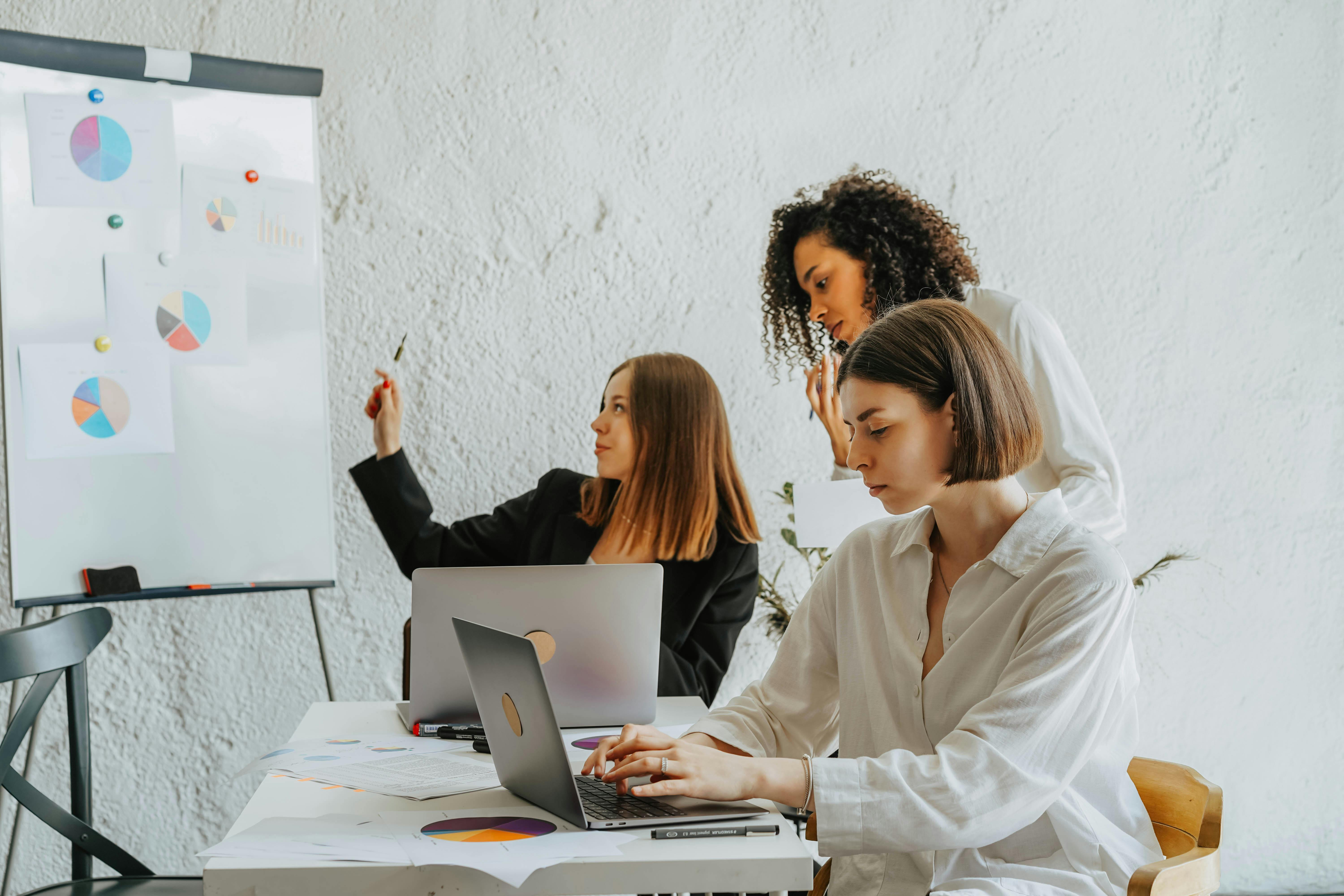 https://www.pexels.com/photo/women-planning-together-at-work-8145248/